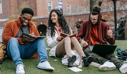 Students on campus studying 